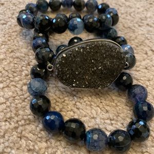 Blue beaded bracelets with one black stone